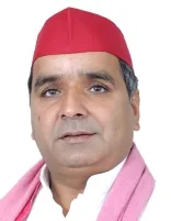 Dharmendra Yadav in his official Lok Sabha portrait as Member of Parliament for Azamgarh, Uttar Pradesh, in the 18th Lok Sabha (2024 onwards); head-and-shoulders photograph on a white ground, wearing the Samajwadi Party cap and a pink scarf