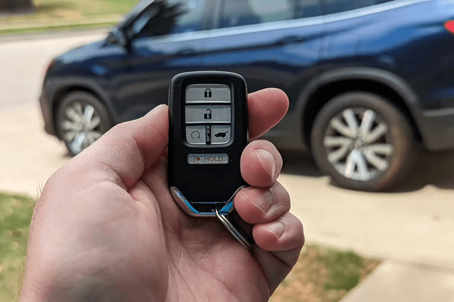 Car key replacement service in the USA with locksmith programming a modern smart key